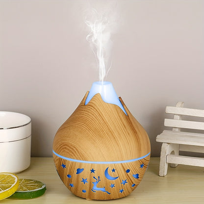 Aroma diffuser in lichte houtlook met blauw nachtlampje en nevel